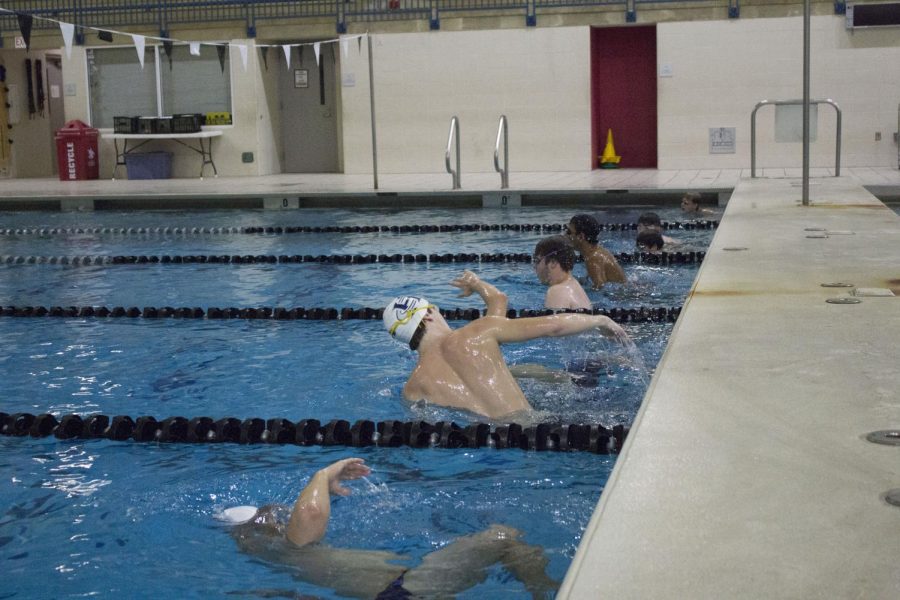 The boys swim a specific amount of laps and yardage every practice together as a team.