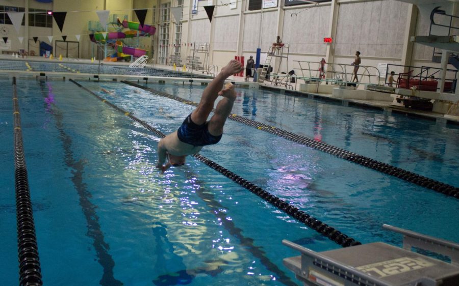 A member of the team rives into the water