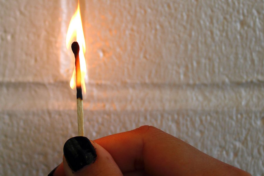 A match slowly loses its fire. This is symbolic of the way gifted students ambition slowly slips away over the years.
