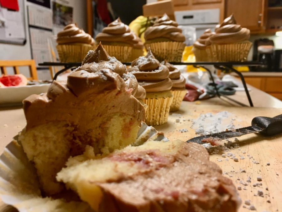 The finished product is sliced open, making the raspberry center visible.