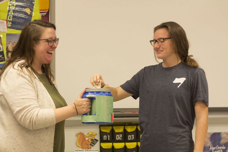 Mrs Crain receives money from junior Rhyen Standridge as a part of the Winter Love Collection through the language department. The money raised was used for making the holiday season enjoyable for students. 