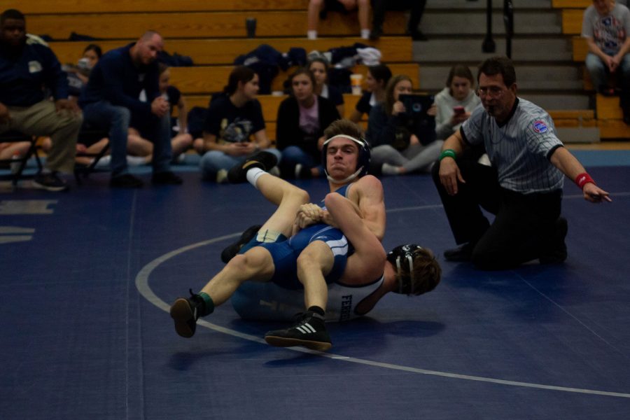 Two boys wrestle on the mats in a recent dual. Francis Howell Centrals wrestling team won with a 39-36 lead.