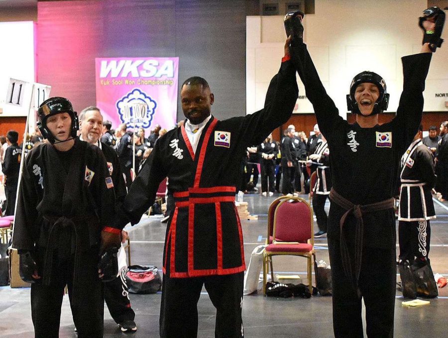 Simpkins competed in the WKSA Kk Sool Won Championship in Galveston, Texas. An official raises Simpkins arm, signaling his triumph over the opponent. 