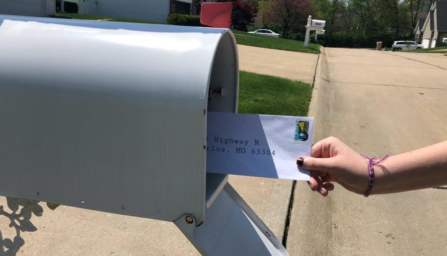 Zoe Michals mailing off a letter to her pen pal. 
