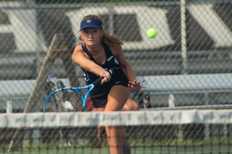 Junior Chloe Schwab, hitting the ball.
