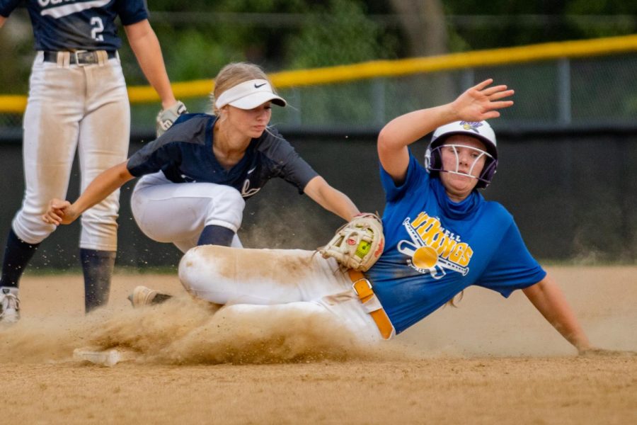 Emily Chadwick, Junior, tagging her Howell opponent out at second base.
