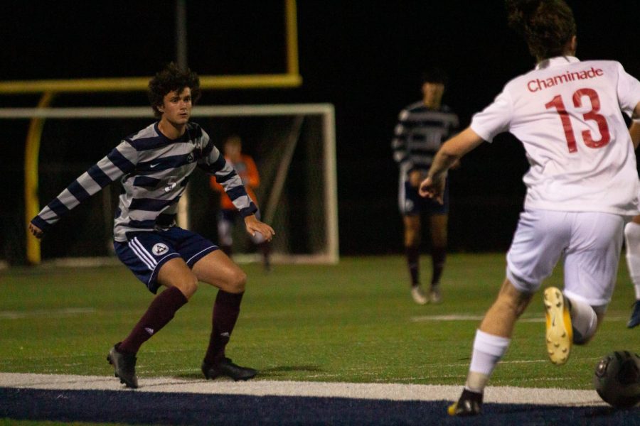 Sophomore Tanner Jones pressures a Chaminade player to pass the ball away or make a mistake at the Sept. 29 home game against Chaminade.