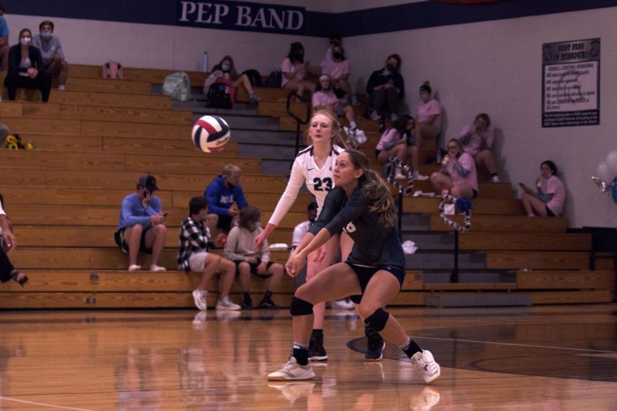 Junior Lexi Arnel crouches in ready position, eyes set on the arcing ball.