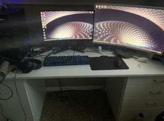An Esports Gamers PC setup is quite complex. It took hours for this gamer to set the two monitors, keyboard, microphone and other electronics up.