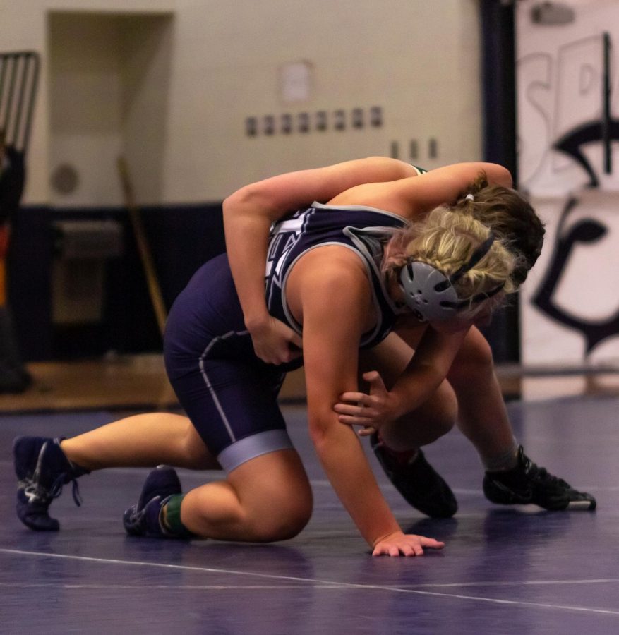 Grace Snyder fights to get her opponent back on the ground.