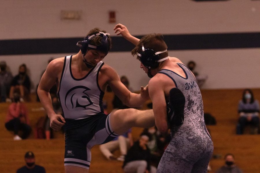 Sophomore Aidan Hernandez takes on a competitor during his dual.