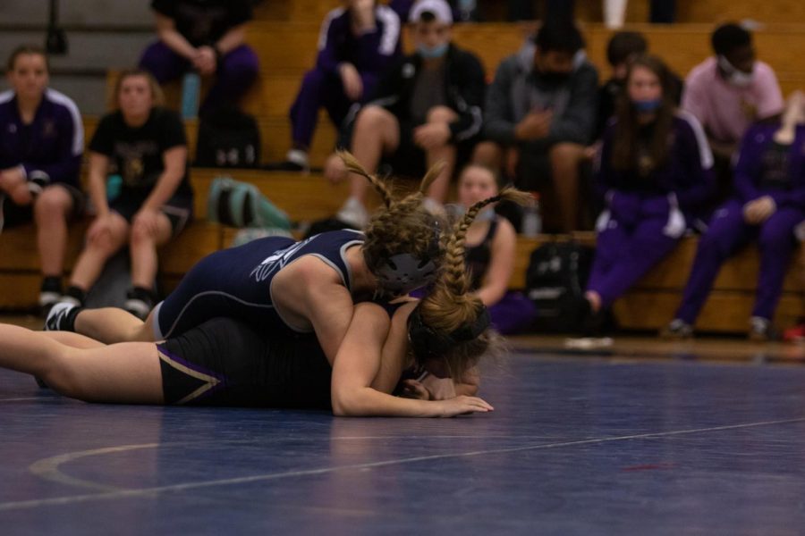 Mary Kate Neal slams her opponent on the mat.