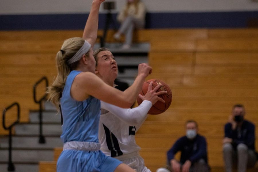 Junior Rylee Denbow going for a layup.