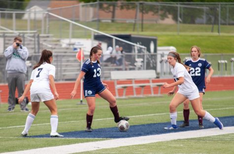 Junior Madi Marstall keeping the ball away from the other team.
