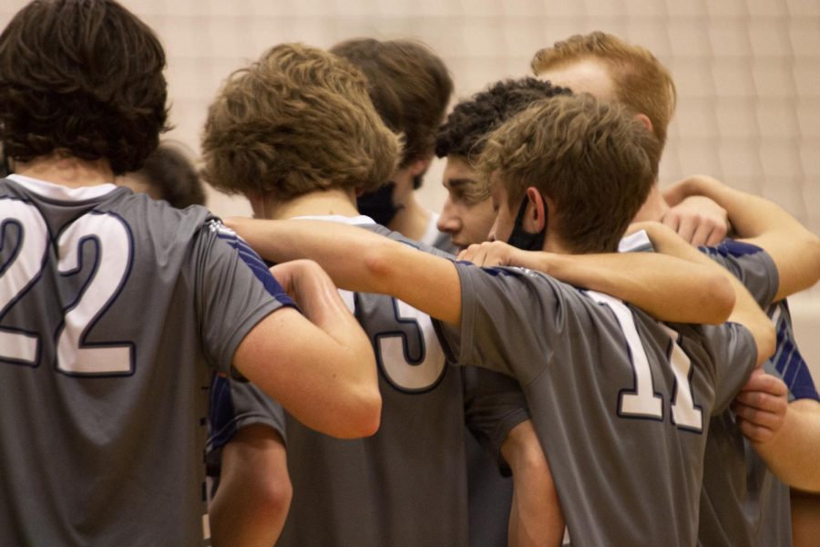 The+boys+huddle+together+after+a+game+at+districts%2C+preparing+to+go+back+onto+the+court.+