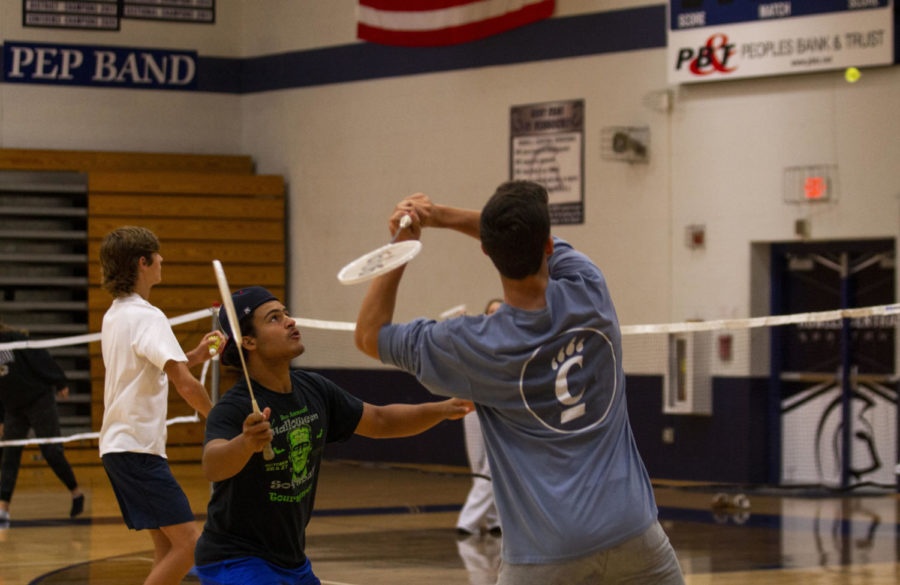 Taking a Swing: Seniors Jayden Jones (left) and Cameron Hill (right)play badminton in their seventh hour Net Sports class. “The three main sports we cover are badminton, volleyball, and tennis. We also play pickleball,” Coach Jennifer Denny, who teachers the class, said.