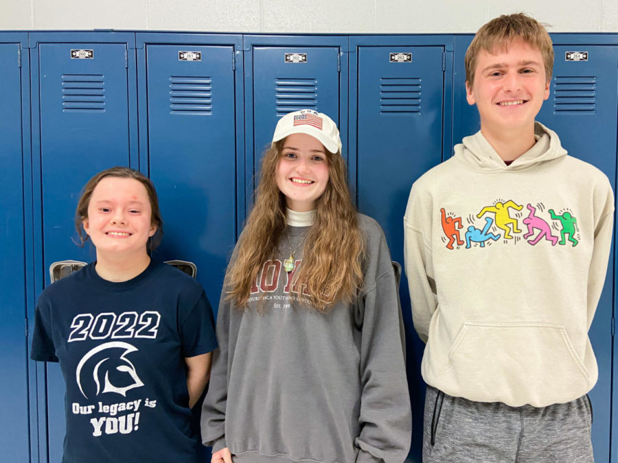 Seniors Anna Baranowski, Hannah Bernard and Jack Schriber line up in front of a set of lockers. All three of the students have been named National Merit Scholars based on their PSAT scores from junior year. In addition, both Baranowski and Bernard were named semifinalists, meaning that they are eligible to apply for the National Merit Scholarship. 