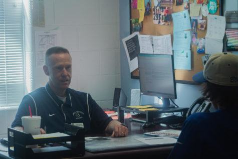 Discussing the Change: Counselor Trevor Wolfe speaks to a student. Discussing with students their grades and how they look could be beneficial to students.
