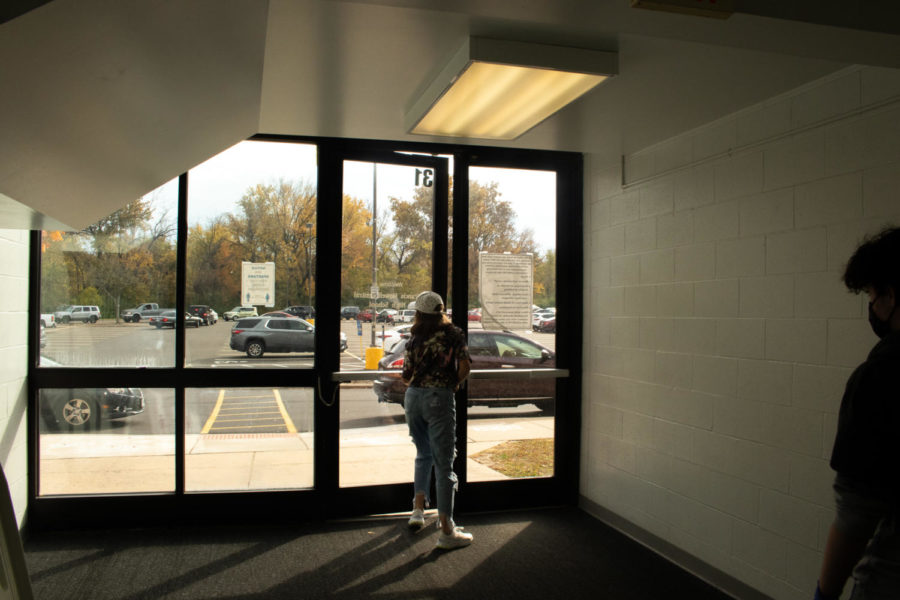 Junior Allie Raines opens the door to begin the nature walk.