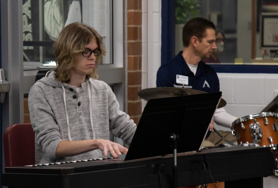 Senior Peter Shea plays the piano while Mr. Griffin plays the drums.