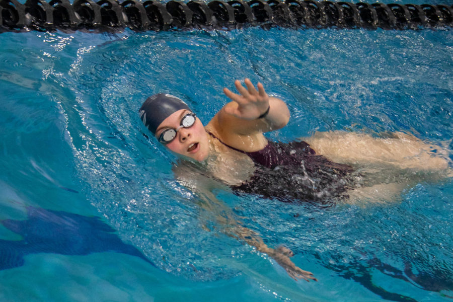 Senior Emma Fox as she swims the backstroke.
