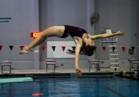 Senior Taylor Steinagel stretches out her arms for her dive.