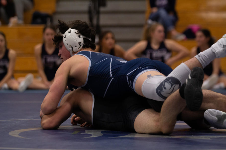 David Cross pinning down his Howell opponent.
