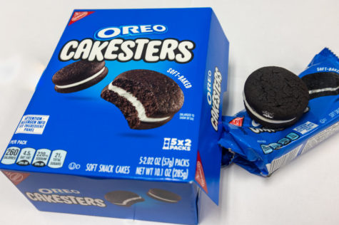 A box of Oreo Cakesters lays open next to one of the snack cakes. These nostalgic snack cakes were discontinued back in 2012 and were recently brought back in 2022, much to the delight of their previous fans. 