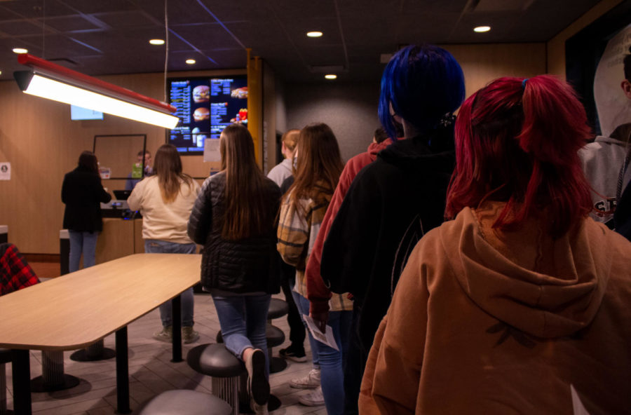 Everyone waits in line to order dinner at McDonalds. The unassuming cashier was shocked at over 30 people entering at the same time.