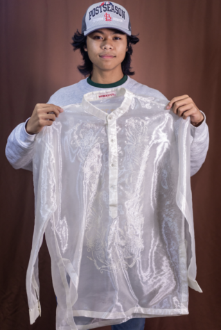 CULTURAL CLOTHING: Senior Faustino Javier displaying clothes from the Philippines. Javier is a first generation American and stays in touch with the culture of his parents through tradition. His family does it not only through holding onto clothing but especially through food.