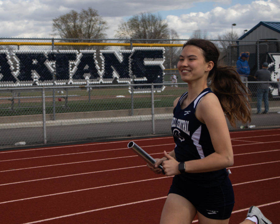 Sophomore Ally Brower smiles as she runs her relay.