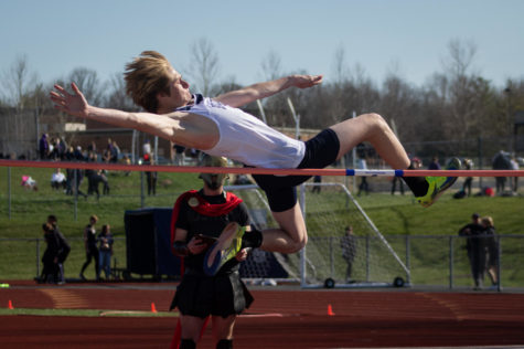 Junior Rolen McDevitt leaps over the pole in his high jump.