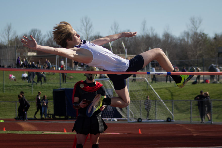 Junior+Rolen+McDevitt+leaps+over+the+pole+in+his+high+jump.