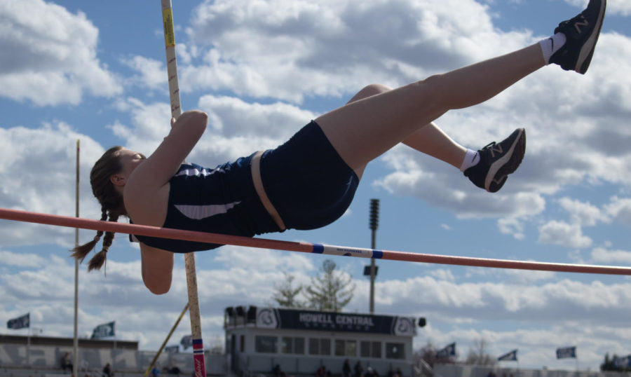 Sophomore Ava Schriber glides over the pole.