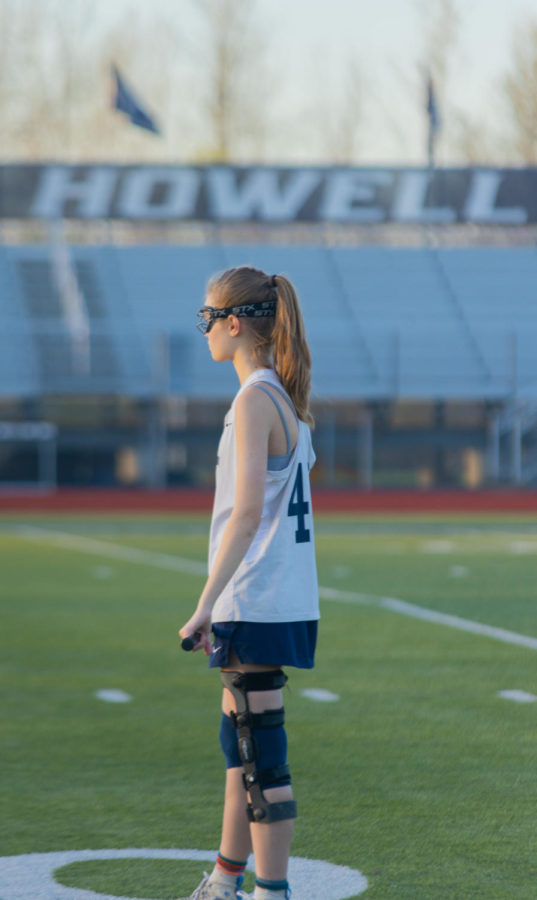 Junior Kara Middleton waits on the field, ready to attack.