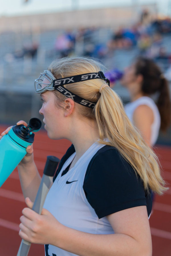 Junior Emma Furlow takes a drink of her water.