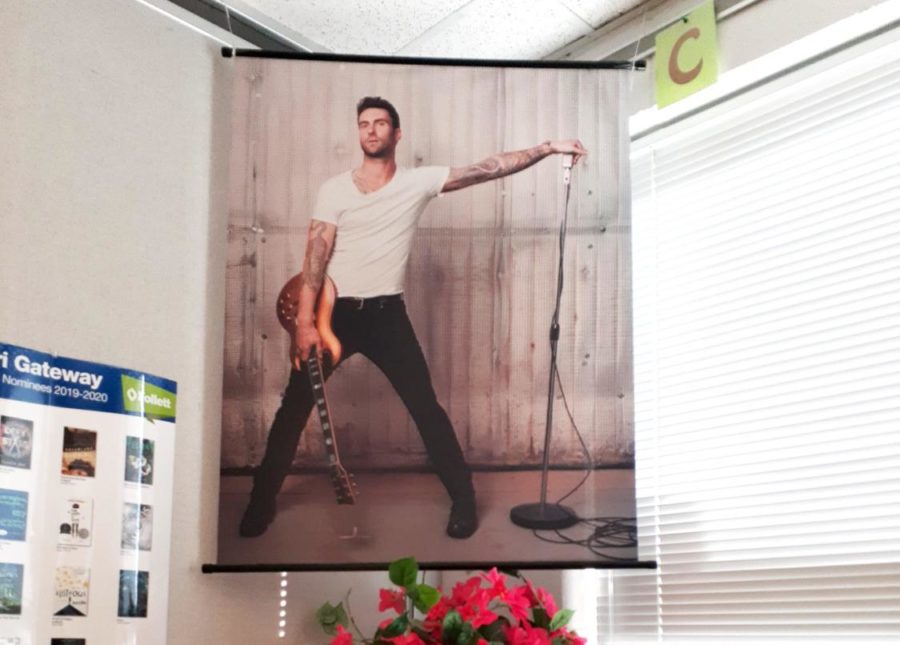 A HIGHER PLACE: Mrs. Christina Lentz’s Adam Levine poster hangs high above
the student’s heads in the corner of her classroom. The poster is loved by
students and an important part of the classroom environment.