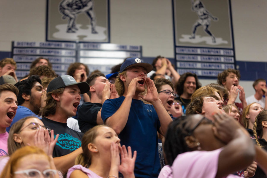 SCHOOL SPIRIT: Students at the May 13th pep assembly cheer loudly in the stands. The spring pep assembly focuses on recognizing students for academic excellence.