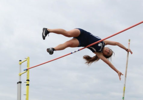 Senior Maddy Mabray flies over the bar on Apr. 4.