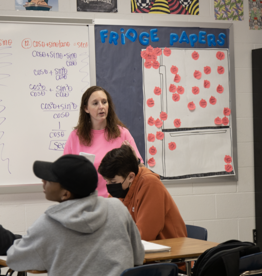 Ms. Morrow lectures her class on their latest unit.  She is very passionate about math and wants to spread that love to her students.  Her positive outlook and willingness to help comforts students about their challenges to math.