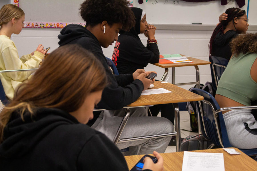 In Ms. Kristen Walerowicz’s third hour class, students pull out their phones for the first three minutes of class. Ms. Walerowicz allows each of her classes three minutes  of screen time before the lesson starts each day. The 3 minutes is helpful because “we barely have any time to get on our phones during the day” said Freshman, Aymen Mohammad. 