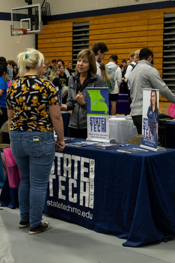 College representative Sally Difani speaks to a student about the perks of attending State Tech. “We are really trying to give our students the college experience during the 2 years they are with us,” Difani said.
