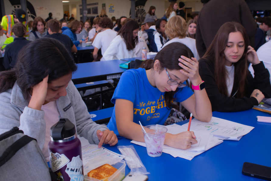 Lizy Lopez uses her lunch time to catch up on assignments.