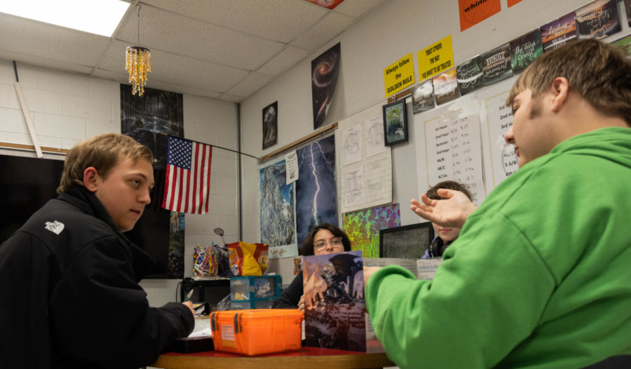 Members of Games Club playing a game of Dungeons and Dragons during their weekly meeting in Mrs. Okai's room. 