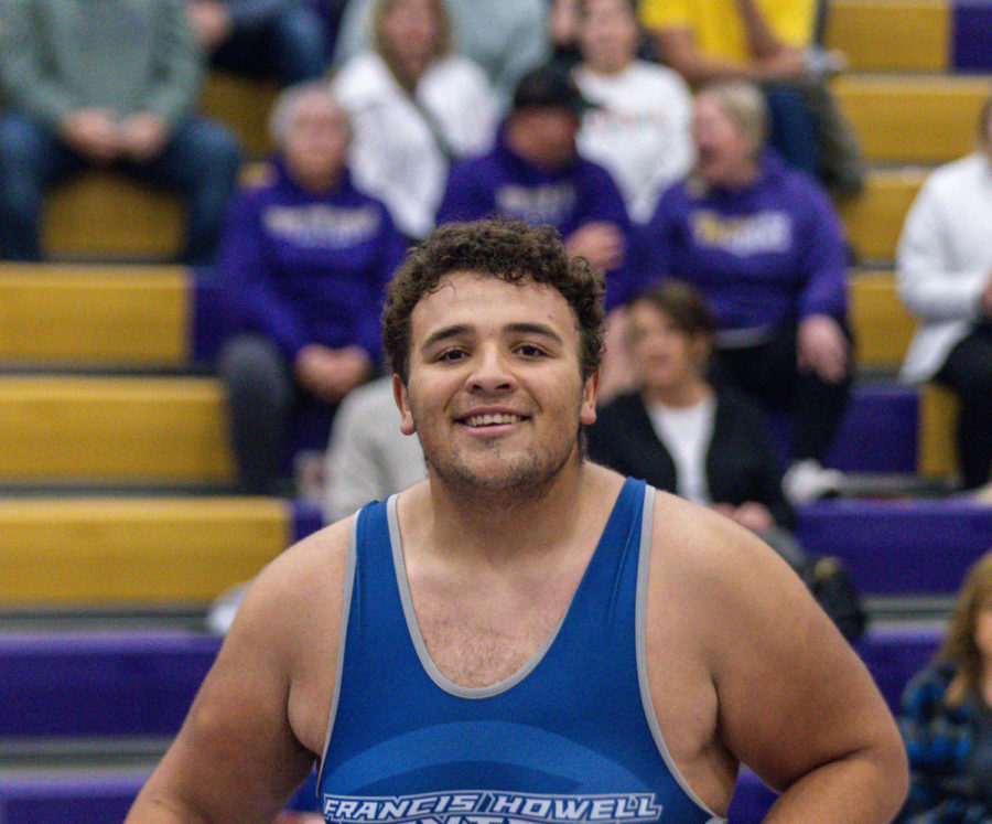 Spencer Flemming smiles at the camera while waiting for the match to begin.