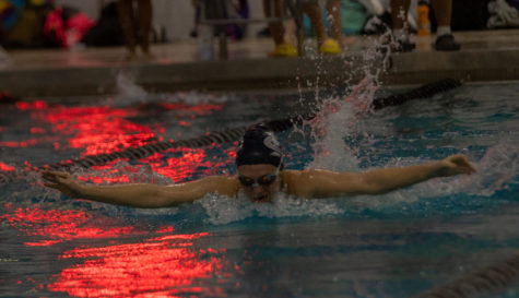 One of the girls swimming her butterfly.