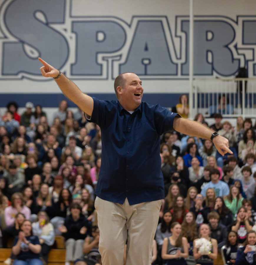 Activities Director Scott Harris smiles at the student sections, showing his passion for FHC during a pep rally.