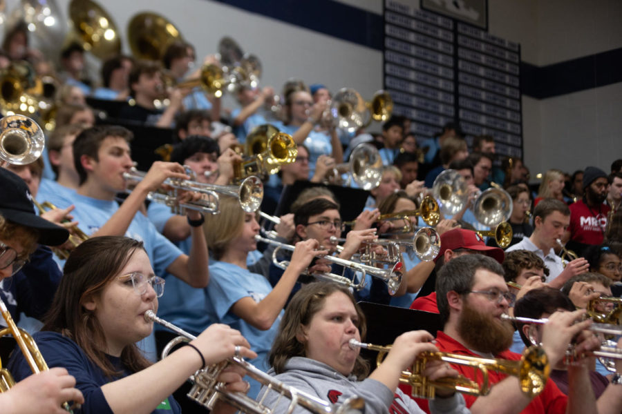 The A-Band plays a familiar song during a break in the action during the girls basketball game on Dec. 19 in order to pump up the crowd. I show up for the connections and moments that we make together, Izzy Hoffeditz said.