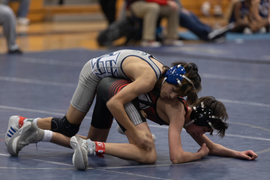 Sophomore Vincent Castille holds his opponent down during the 2022-23 season.