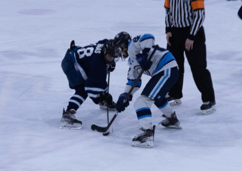 Sophomore Jacob Haas faces off with a Westminster player.